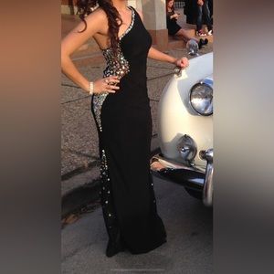 Off shoulder black form fitting dress